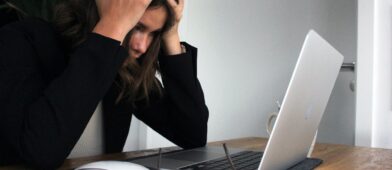 Stressed out woman in front of her computer