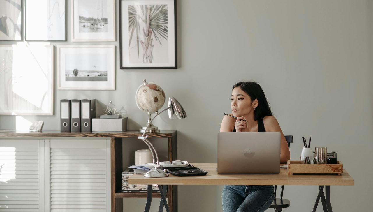 woman sitting at computer in home office