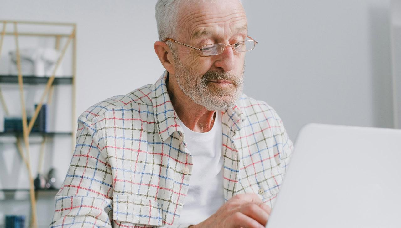 man sitting at computer